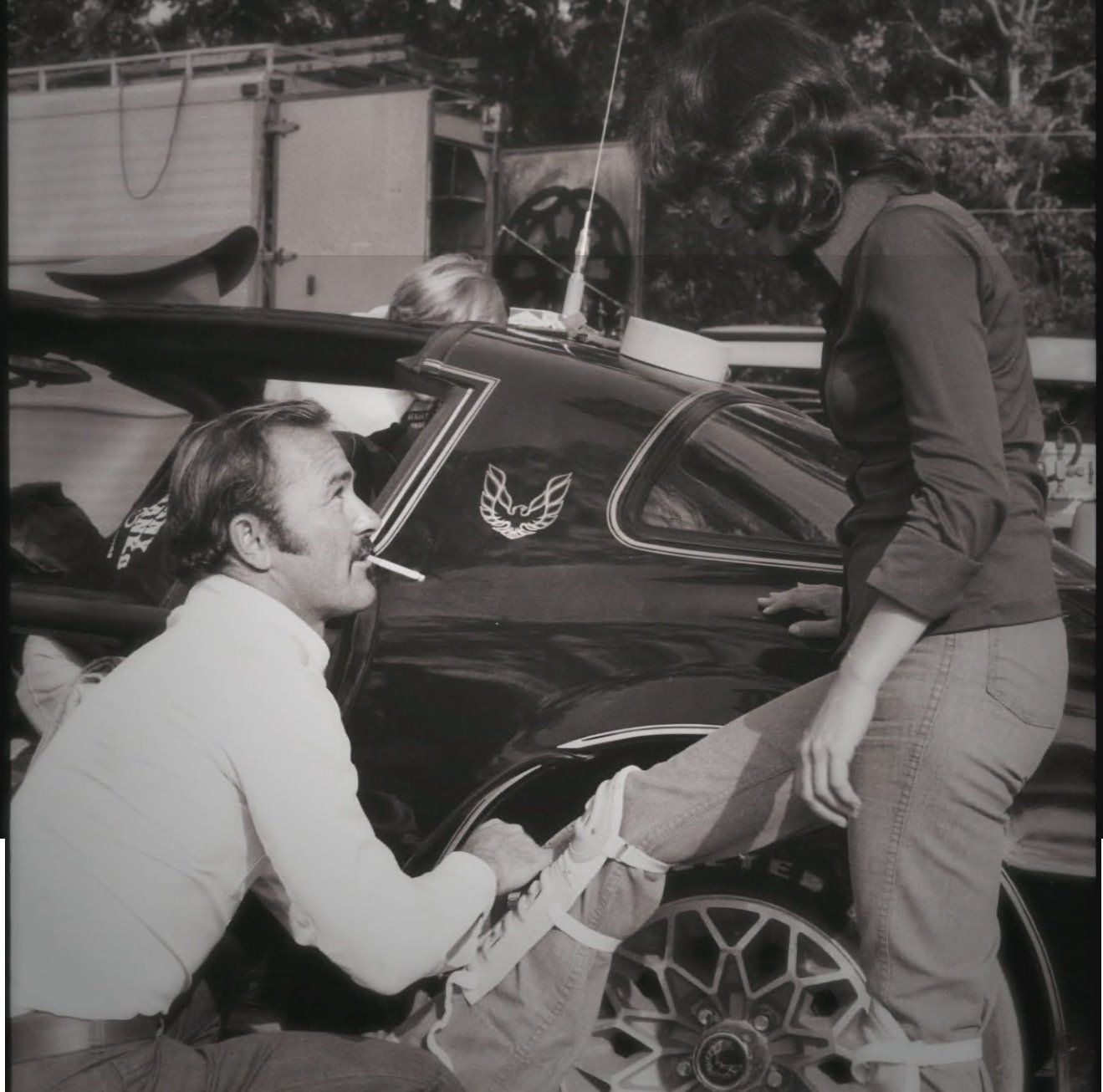 Alan Gibbs helping Janet Brady install shin guards.